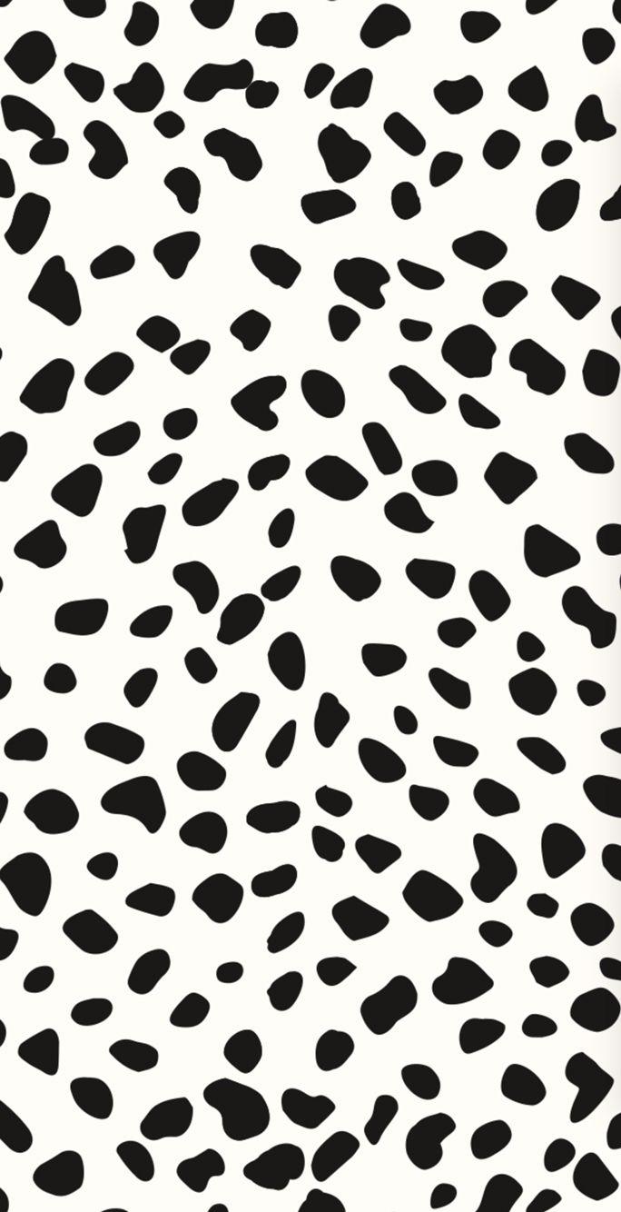 A black and white pattern with dots - Cow