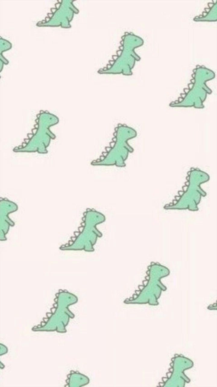 A pattern of green dinosaurs on pink background - Dinosaur