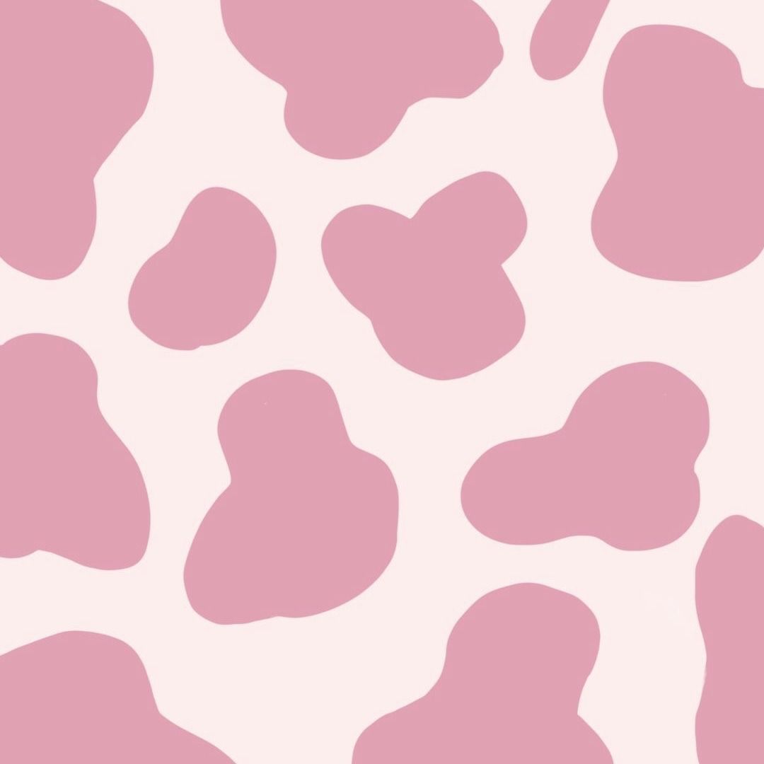A pink and white cow print pattern - Cow