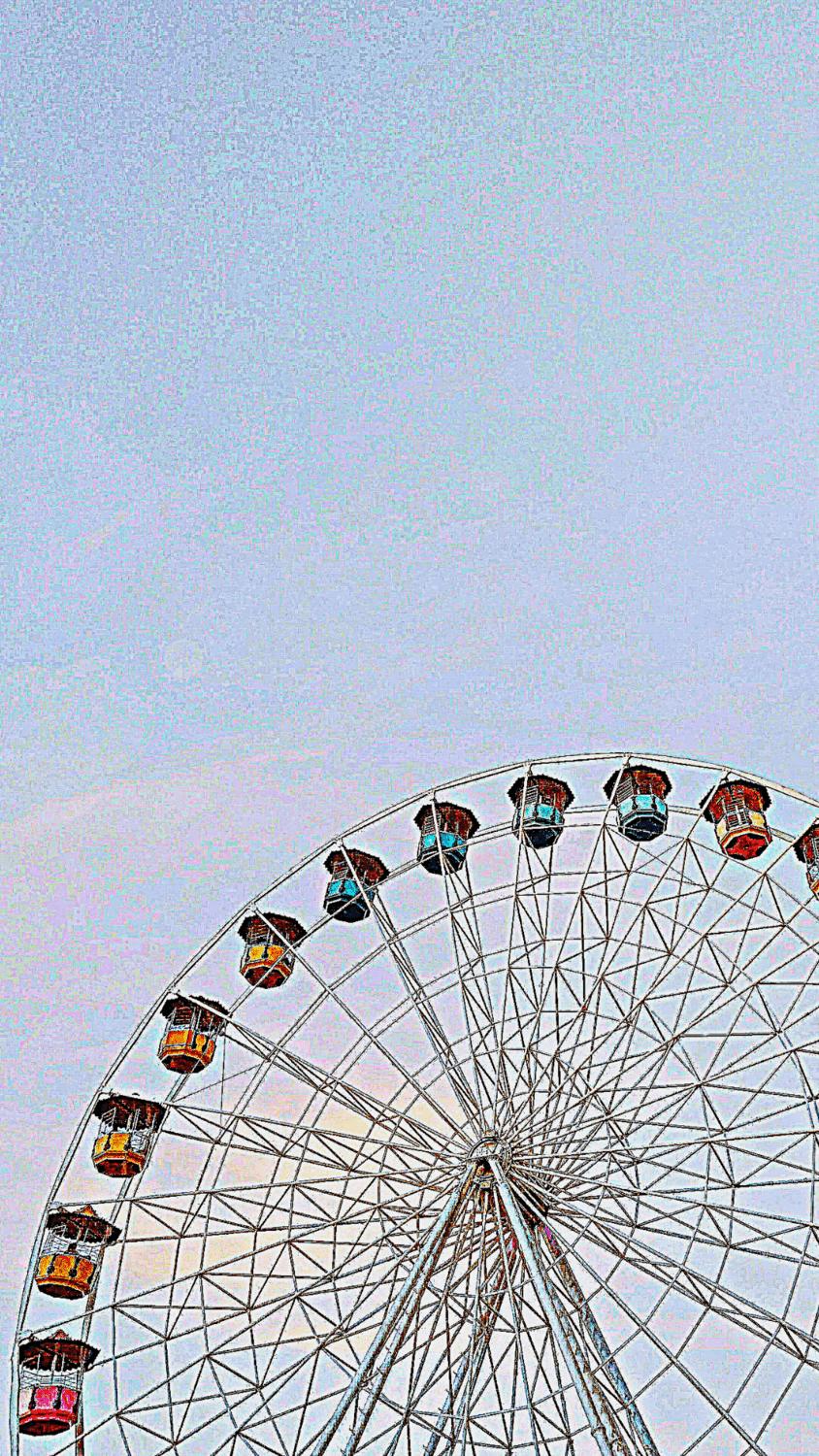 A Ferris wheel with cars on it in the sky. - Kidcore