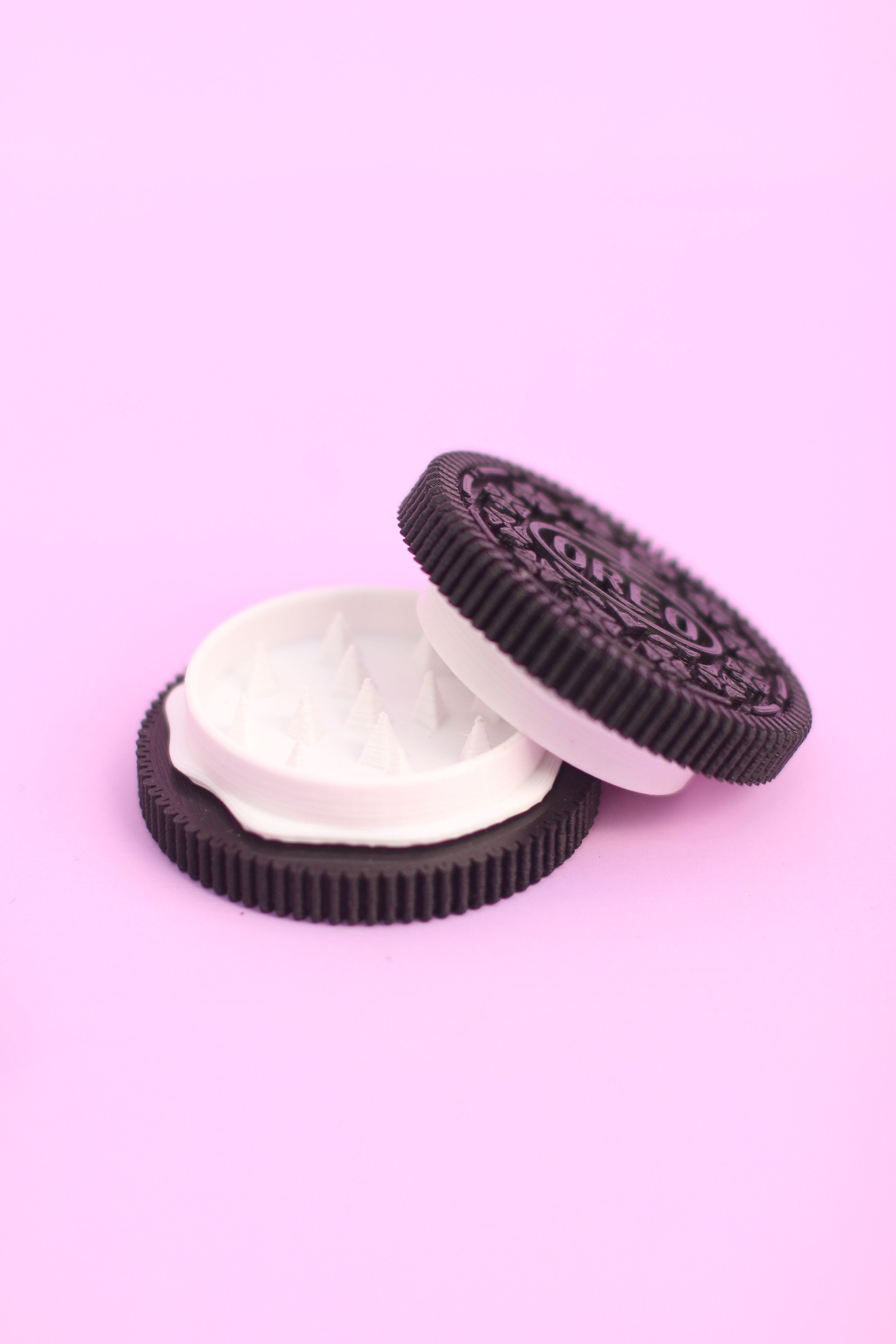 A cookie is sitting on top of another - Oreo