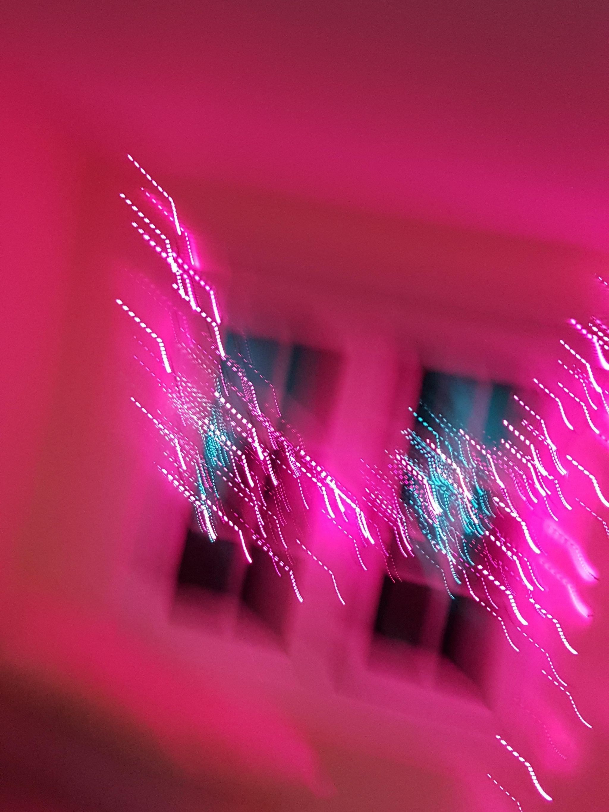 A blurry image of pink light in the window - Blurry