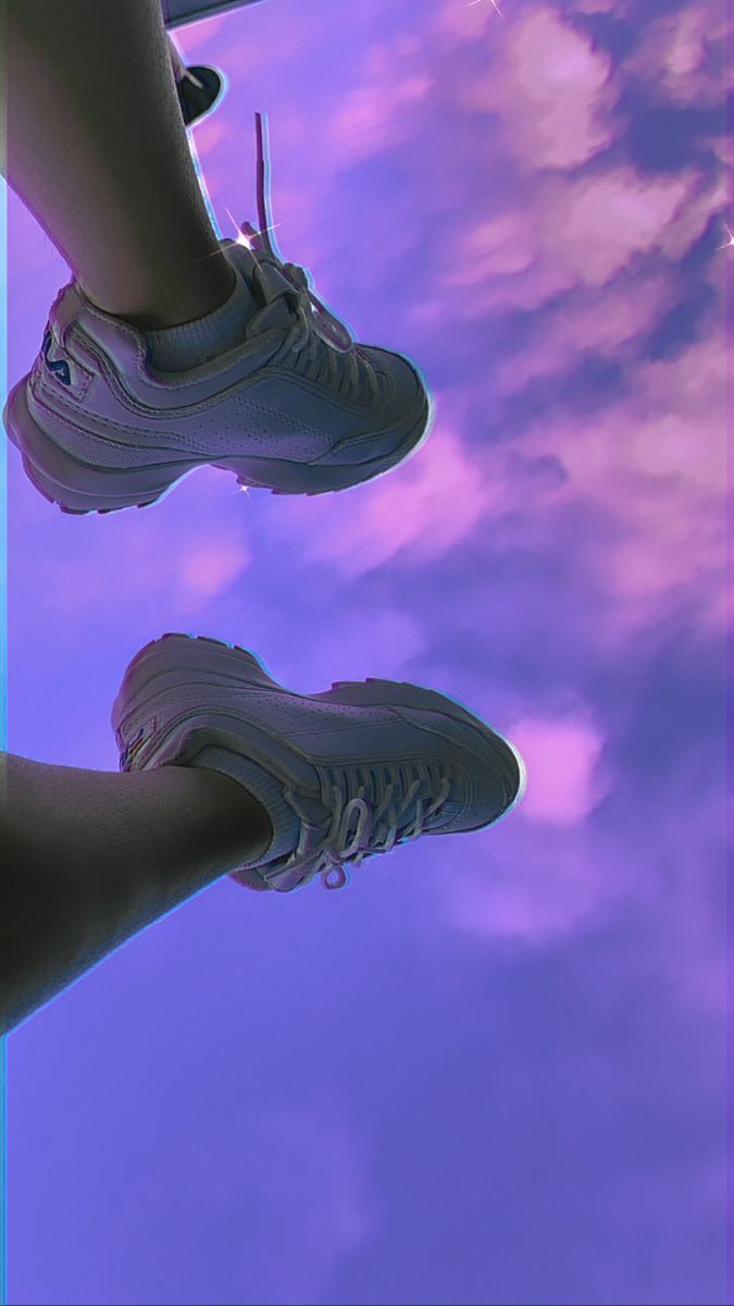 A person standing on top of the clouds - Shoes