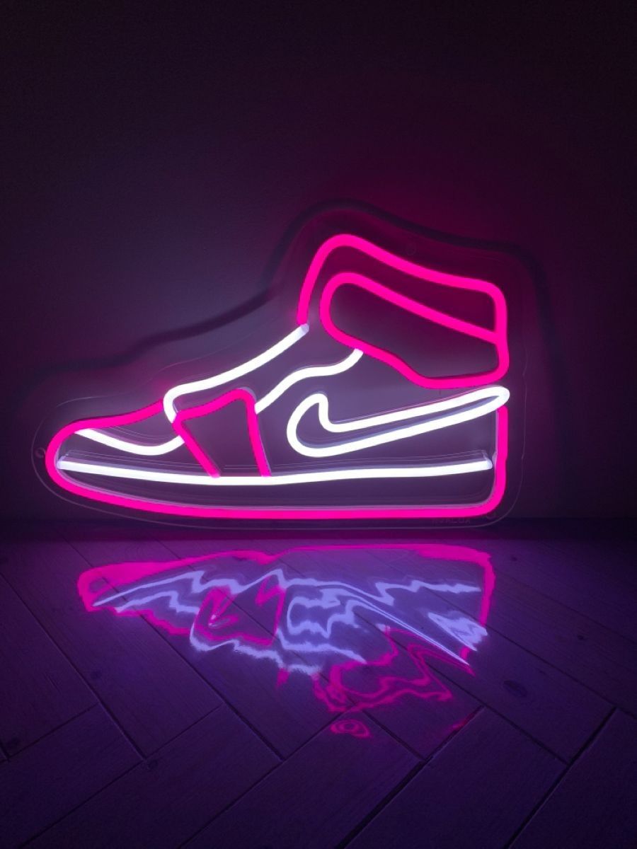 A neon sign of a pink Nike high top sneaker. - Shoes
