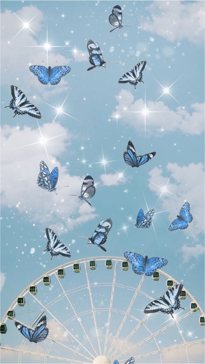 A ferris wheel with butterflies flying around it - Butterfly