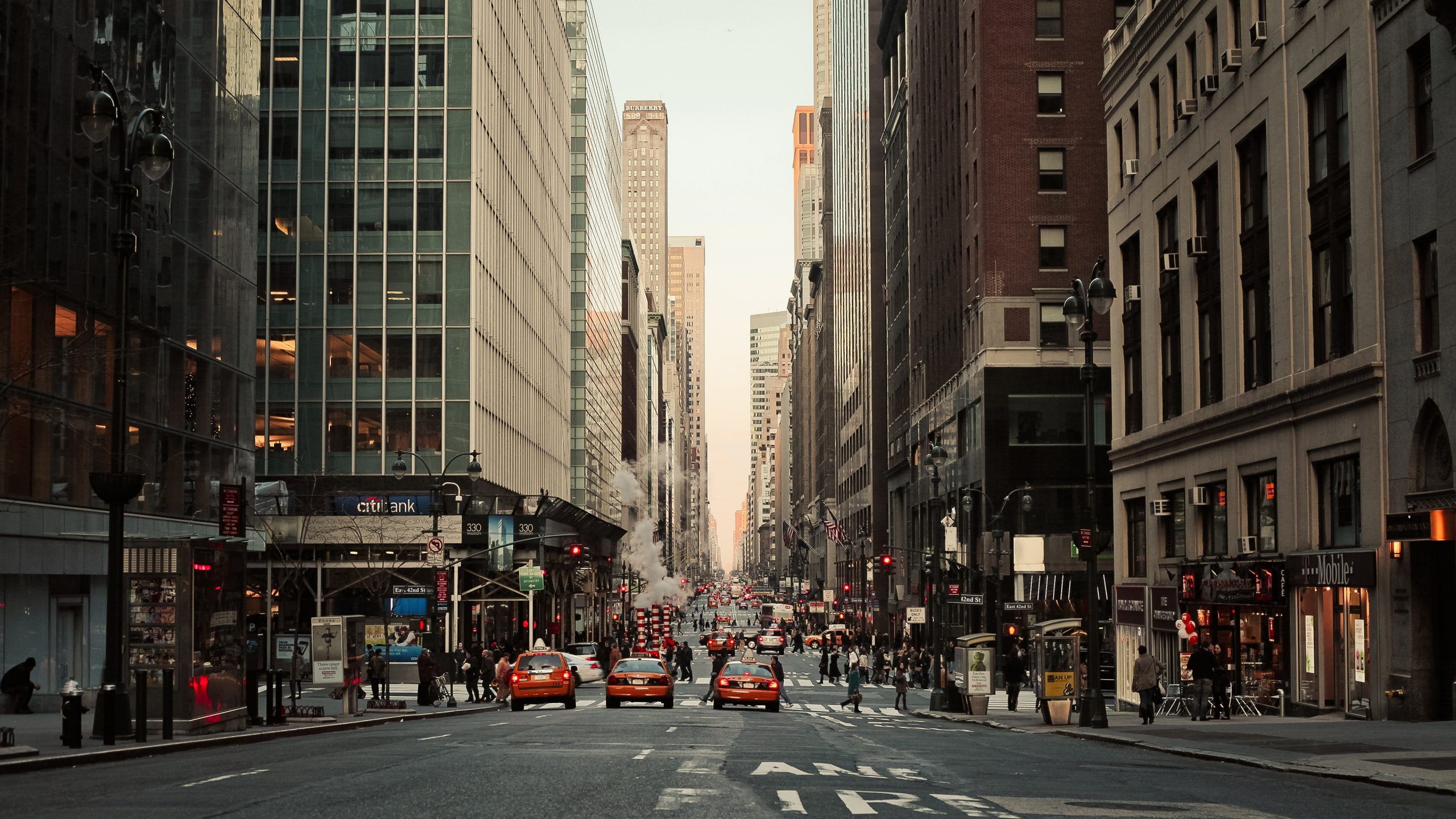 A city street with cars and people - New York