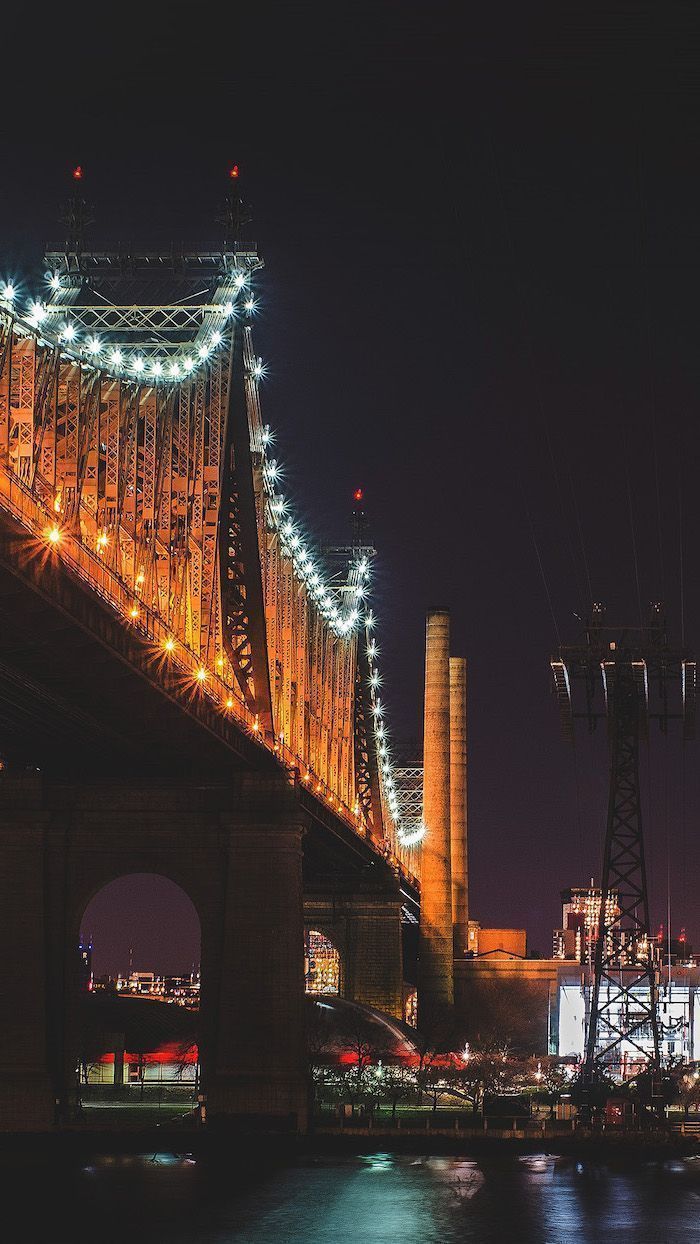 A bridge that is lit up at night - New York, cityscape, skyline, city
