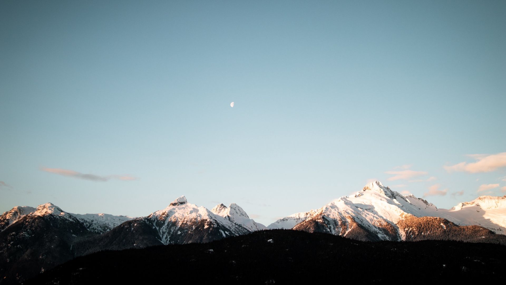 A mountain range with the moon in front of it - Mountain