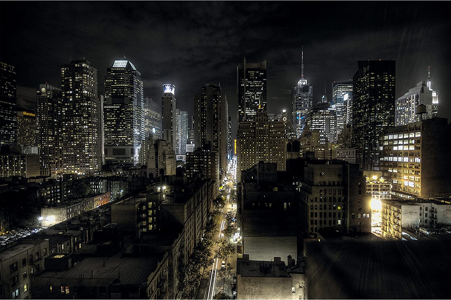 A city at night with many tall buildings - New York
