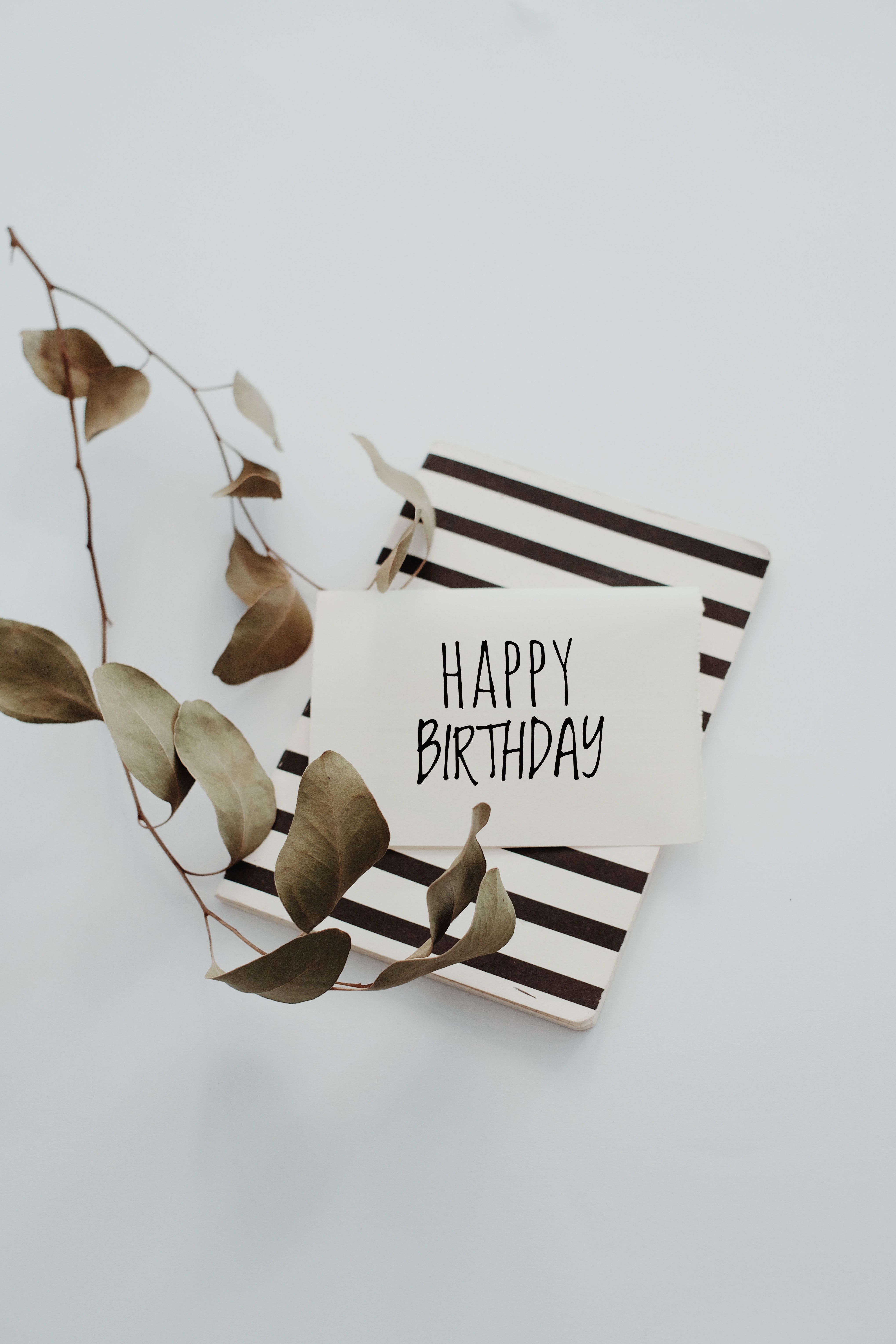 A striped card with the words happy birthday on it - Birthday