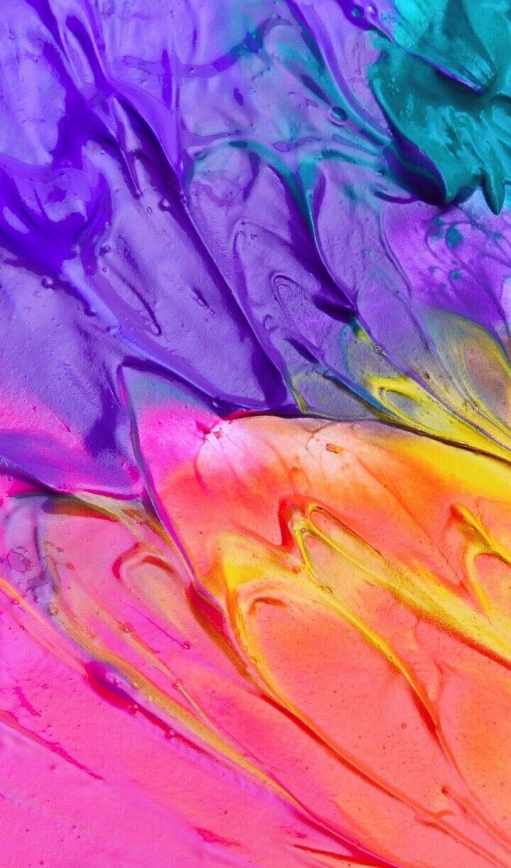 A close up of colorful paint on the surface - Bright