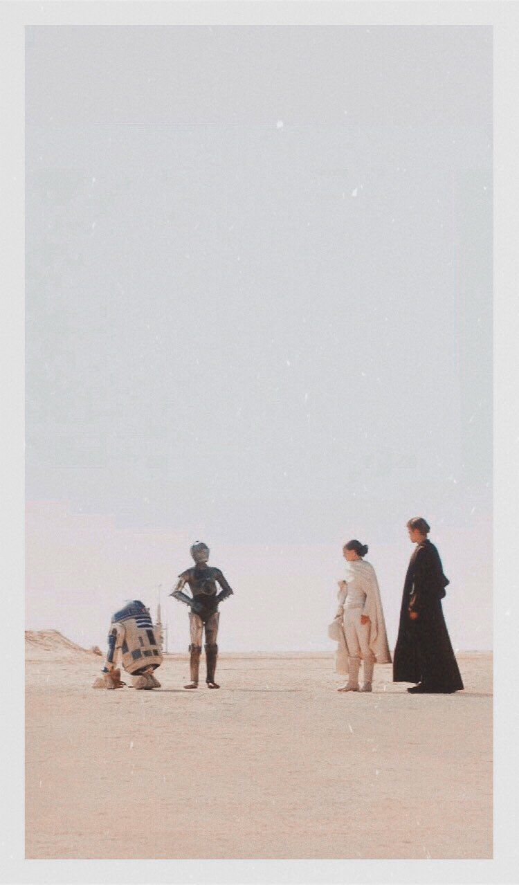 A Star Wars phone background featuring Luke, Leia, Han, and Chewie standing in the desert - Star Wars