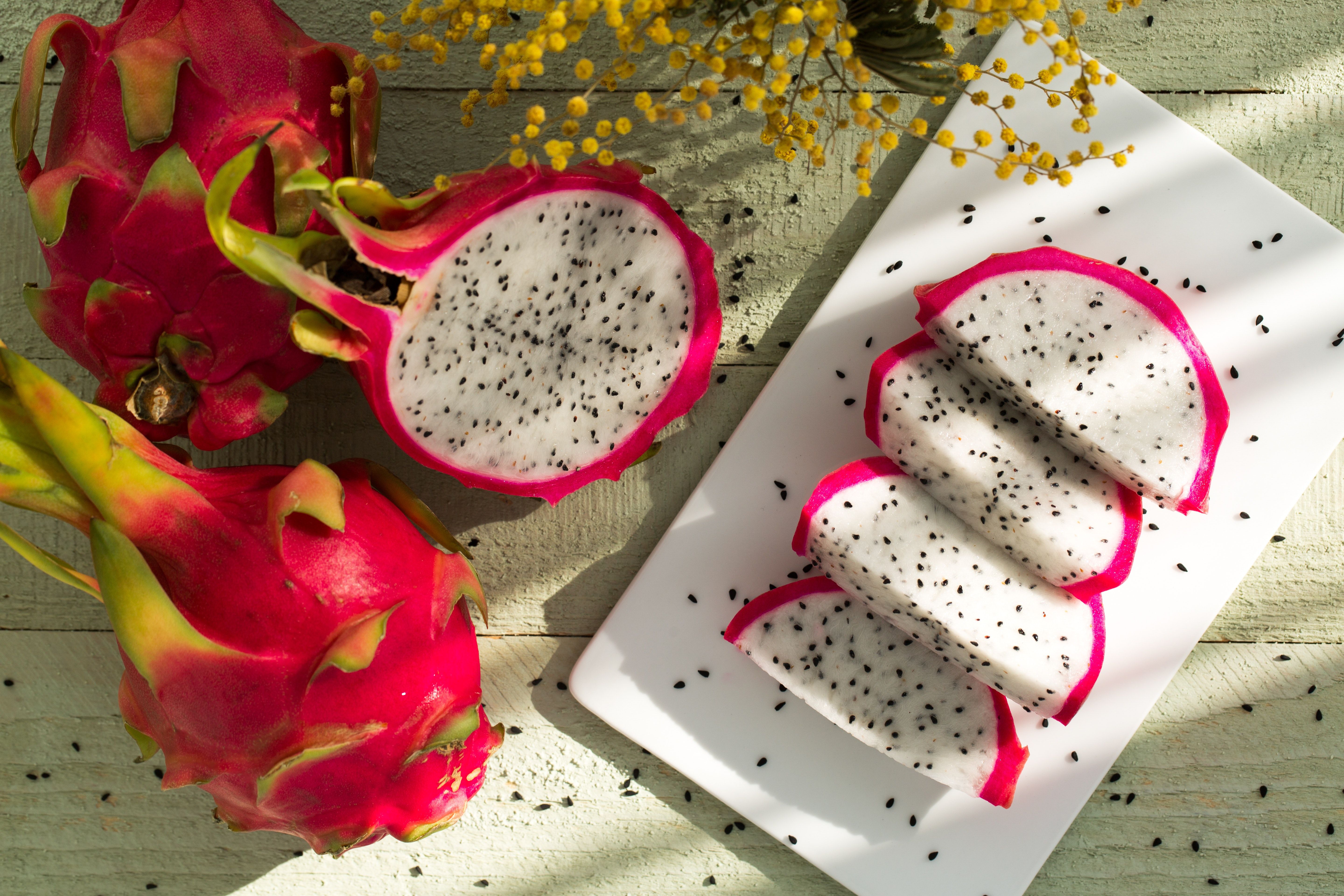 A dragon fruit is sitting on the table - Fruit