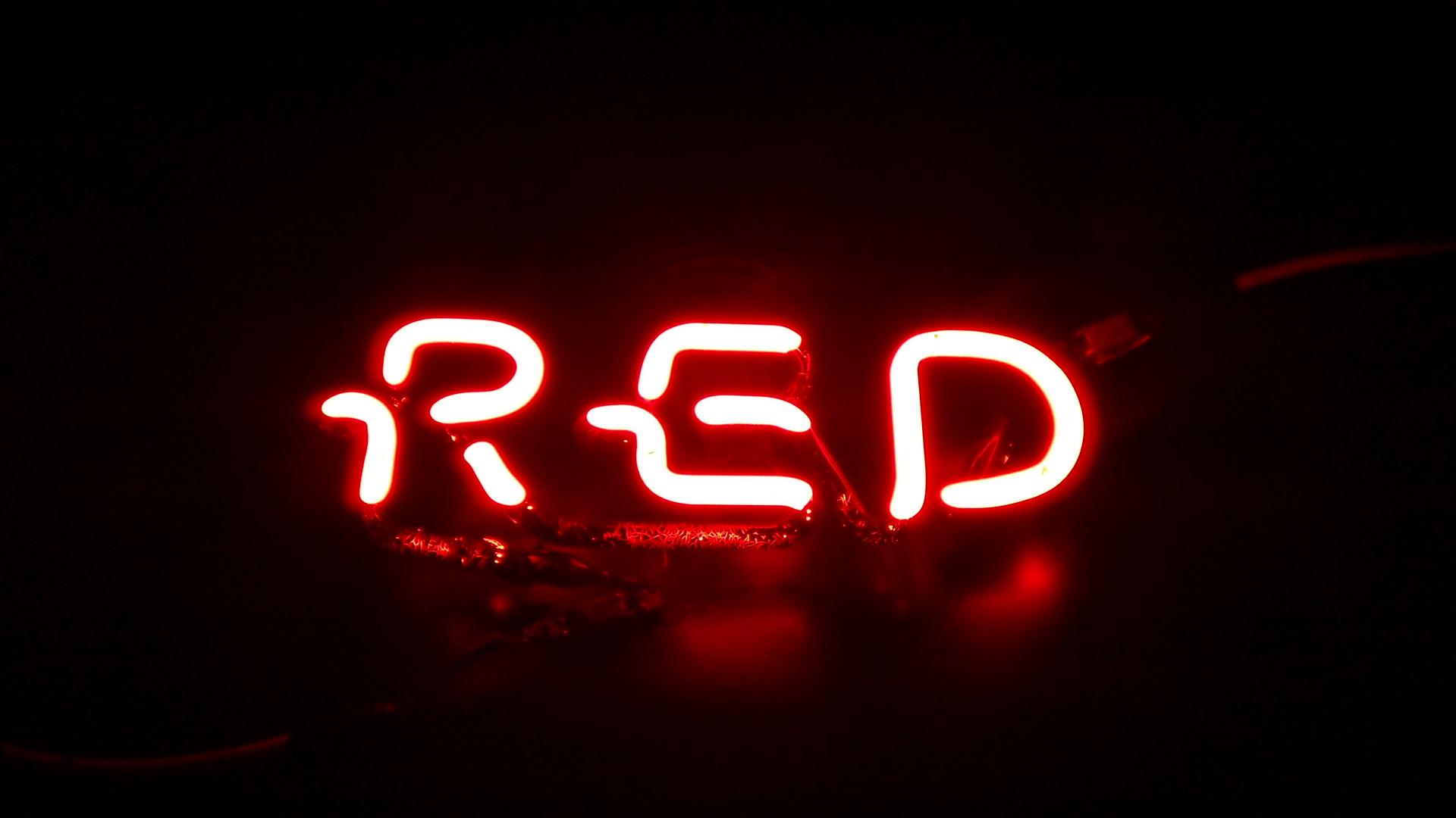 A red neon sign that says 