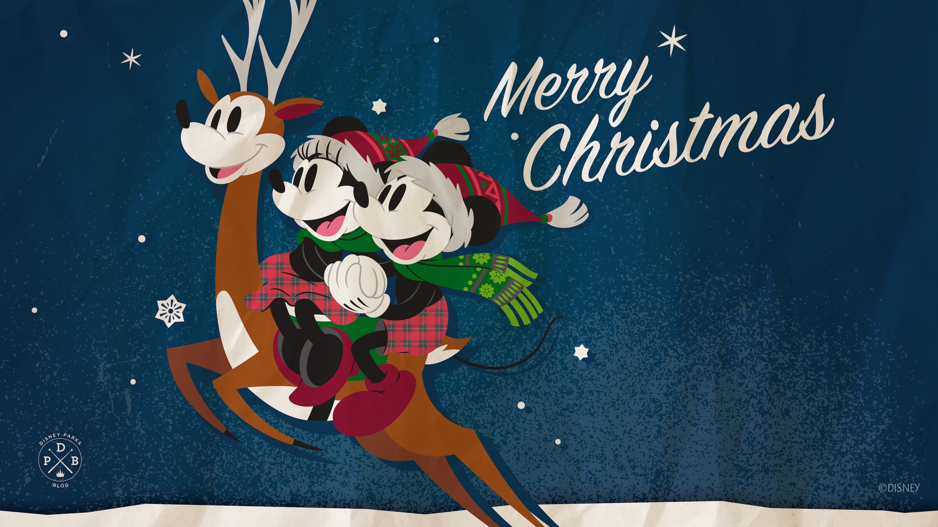 Mickey and Minnie on a reindeer with the text 