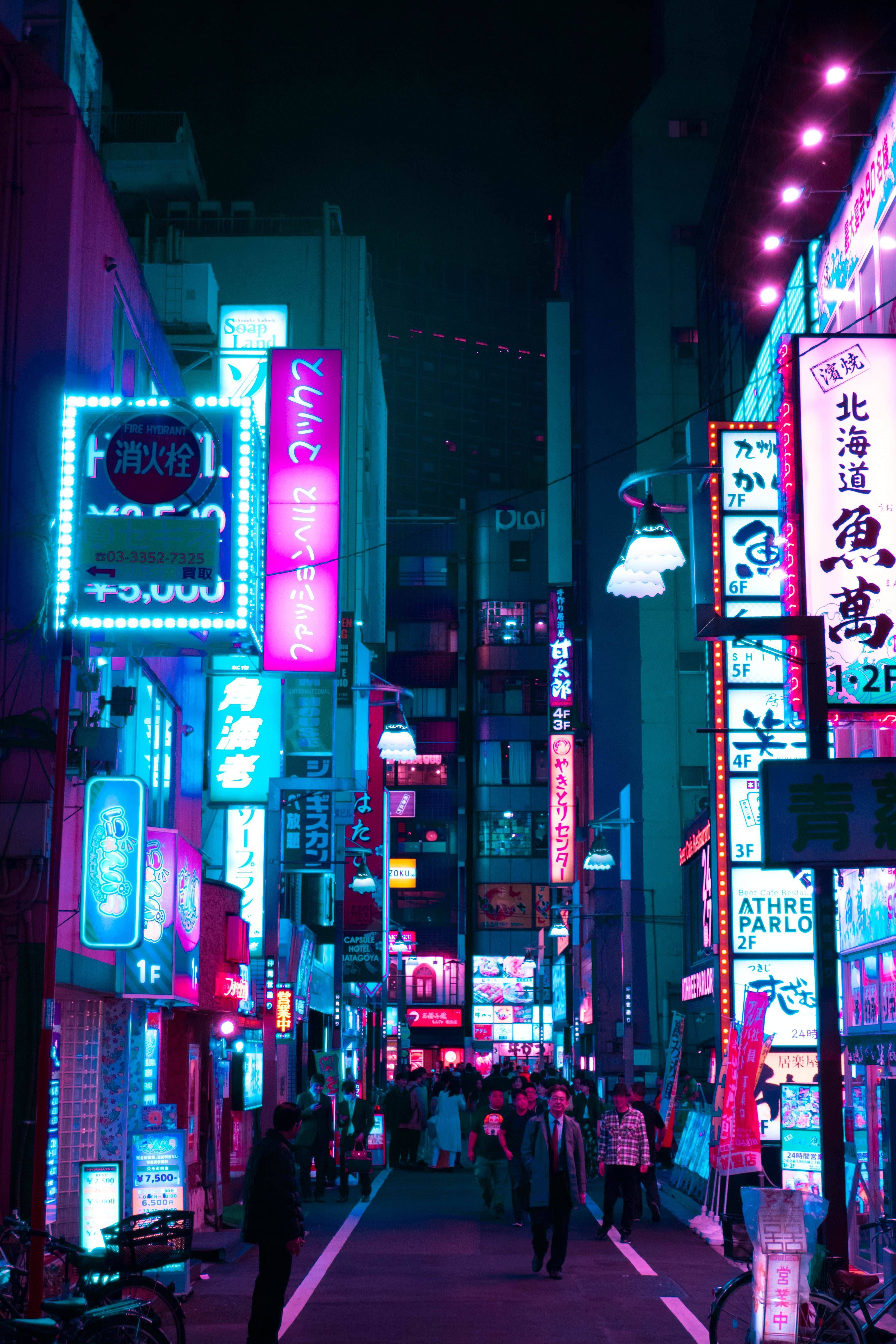 A city street with many neon lights - Tokyo, city