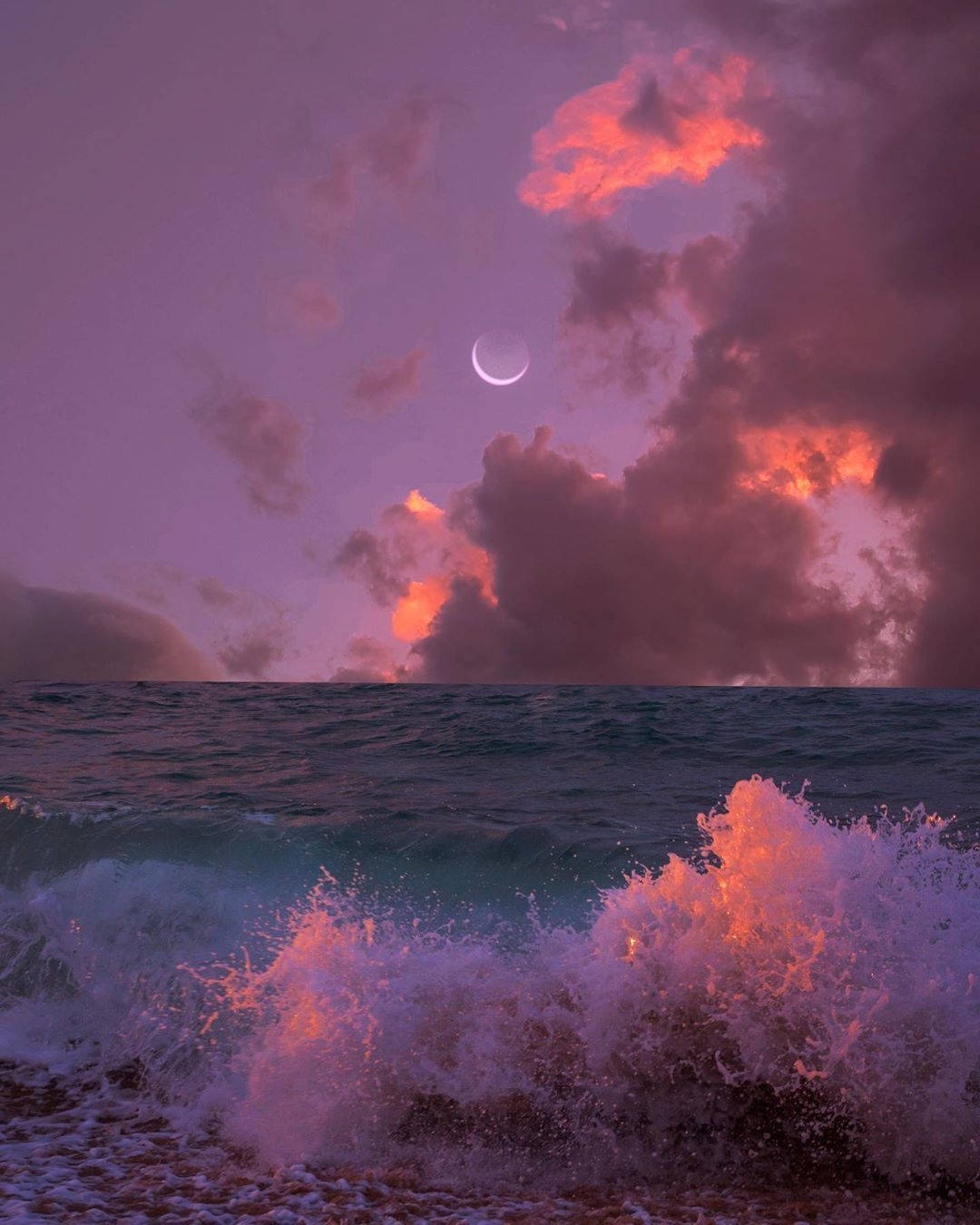 The sun sets over the ocean with a crescent moon in the sky. - Indigo