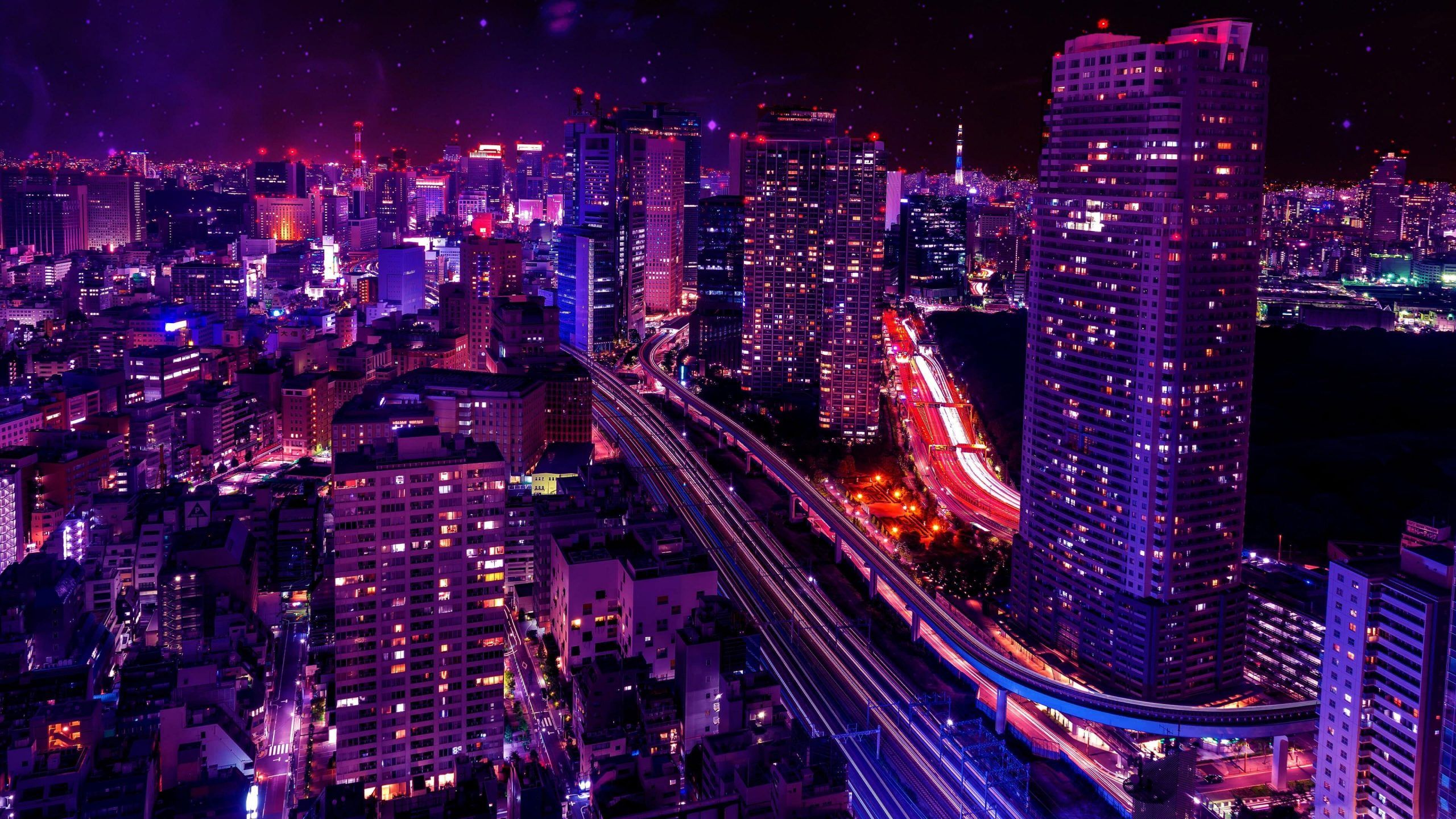 A city at night with purple lights and stars - Tokyo