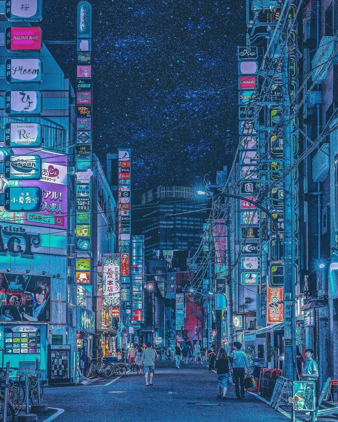 A city street with many neon lights - Tokyo