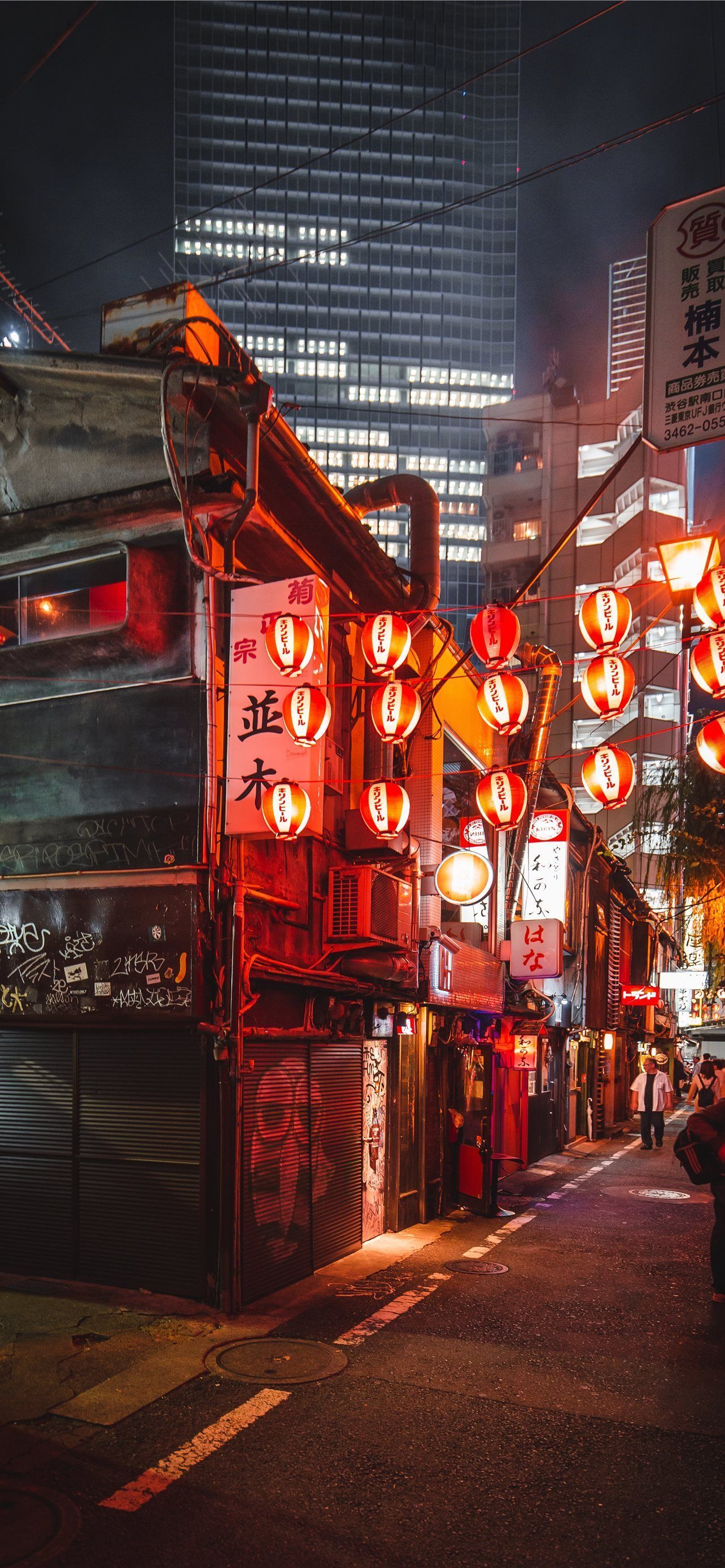A street in Tokyo at night with red lanterns - Tokyo