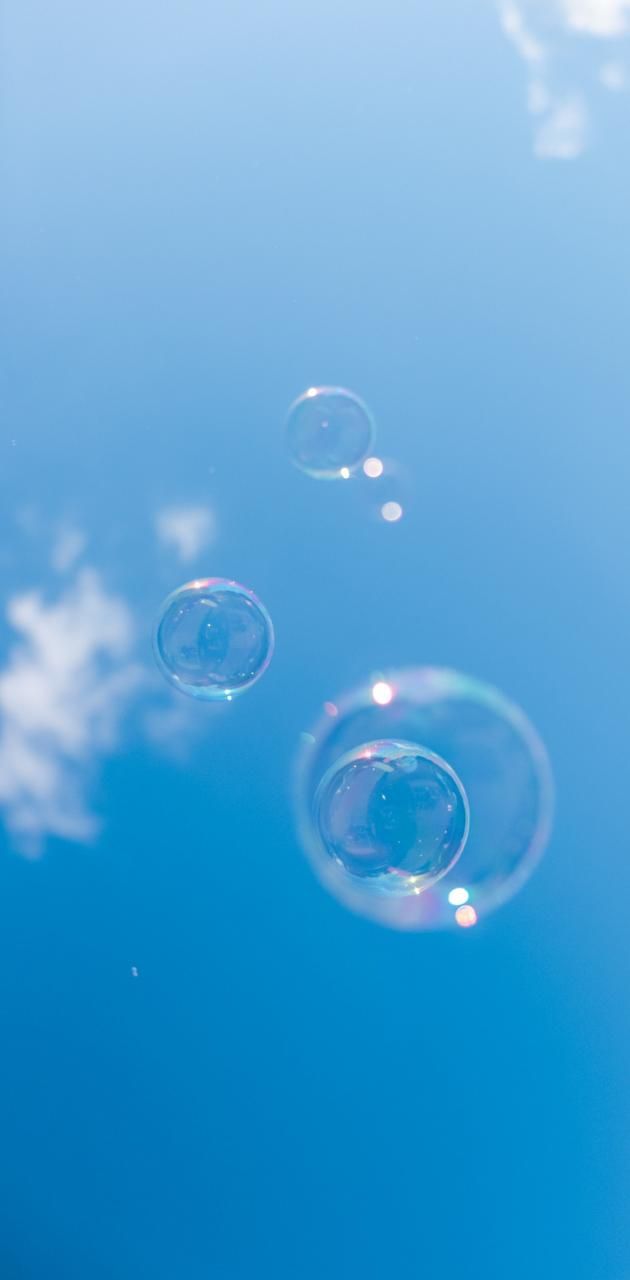 A group of bubbles floating in the sky - Bubbles