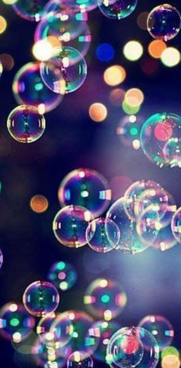 Bubbles floating in the air with a dark background - Bubbles