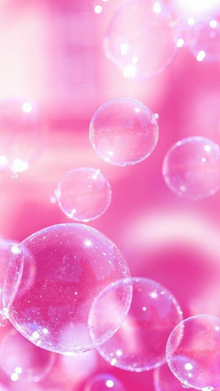 Pink bubbles floating in the air on a pink background - Bubbles