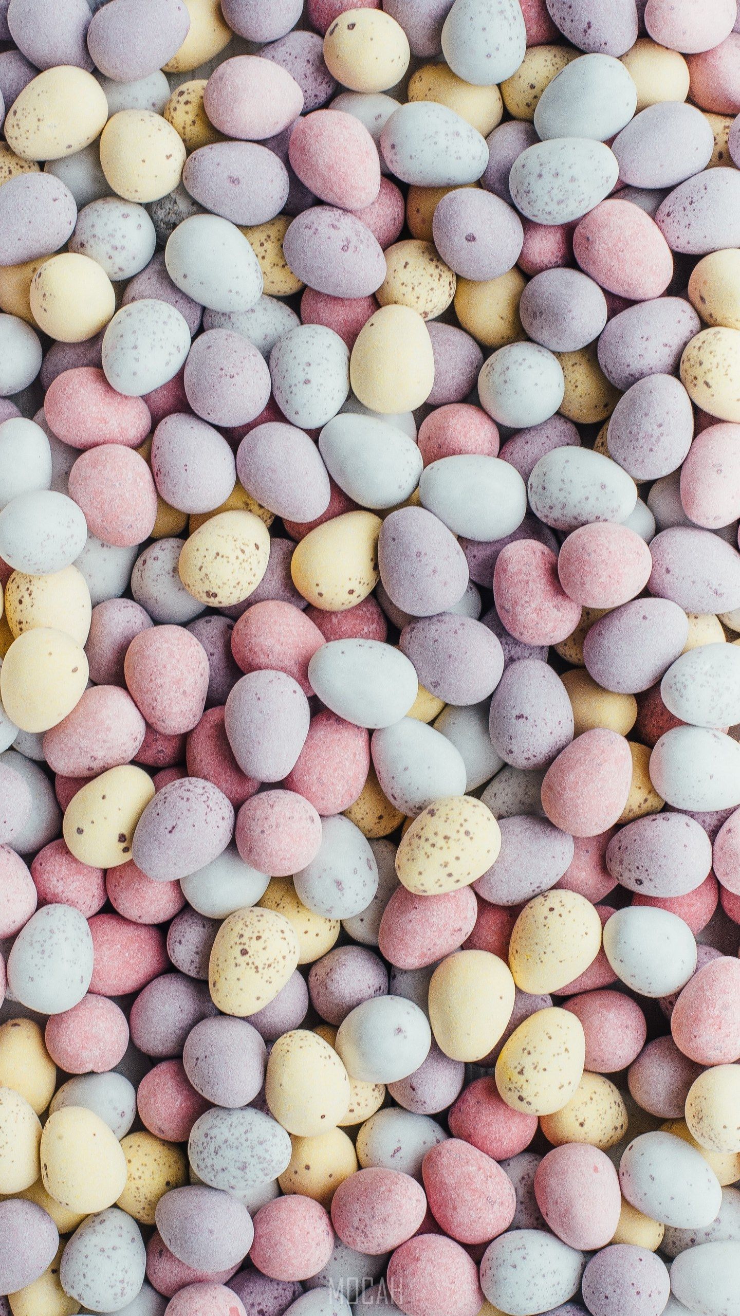 an overhead shot of dozens of candy chocolate mini easter eggs, mini eggs, LG G5 SE wallpaper free download, 1440x2560 Gallery HD Wallpaper