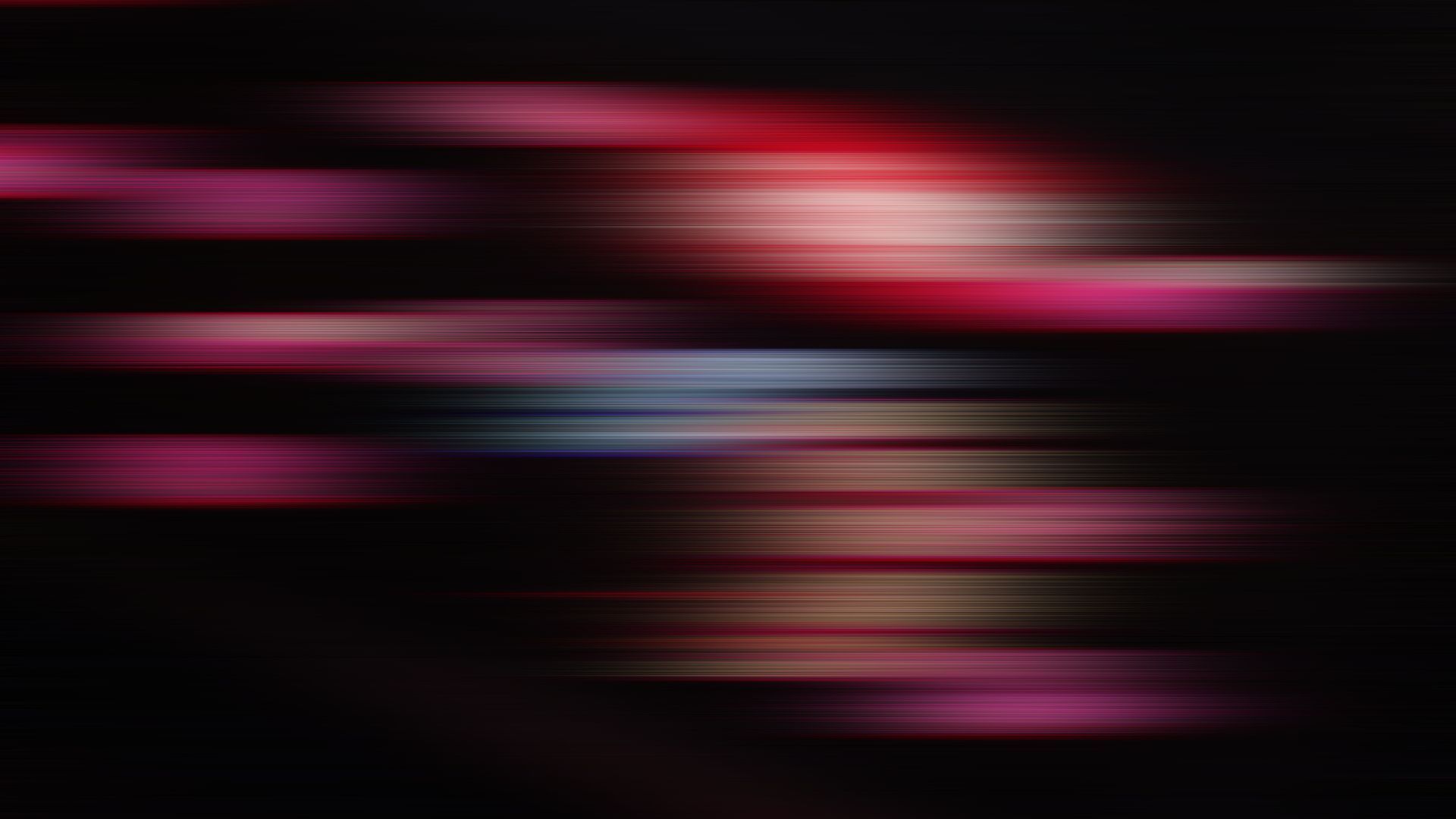 Red, purple and blue abstract lines on a black background - Blurry