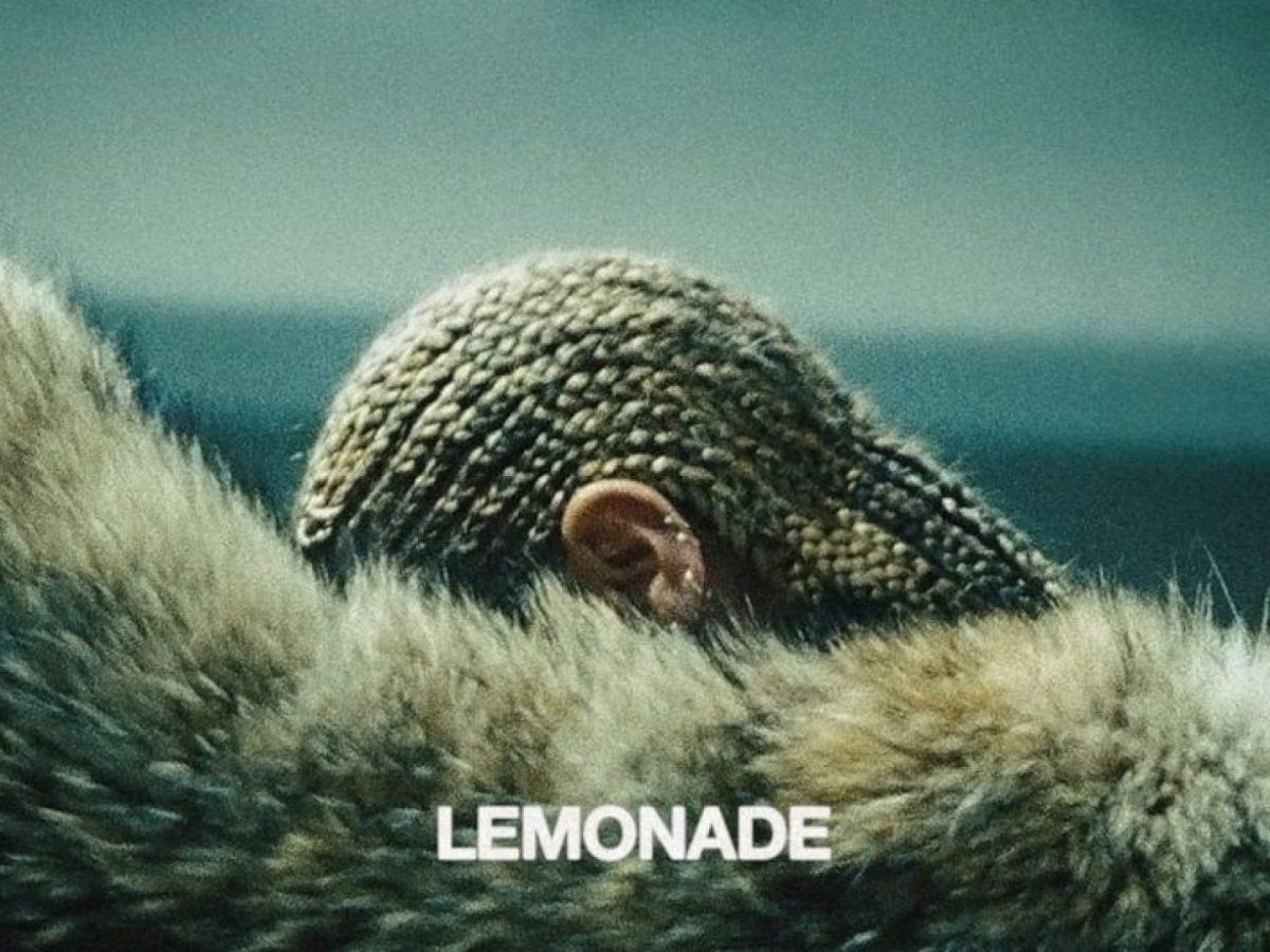 Beyoncé's Lemonade album cover, featuring a close-up of her profile, eyes closed, and the album title in white letters at the bottom. - Beyonce