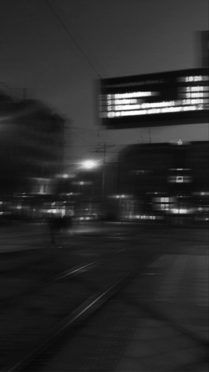 A blurry picture of an intersection at night - Blurry