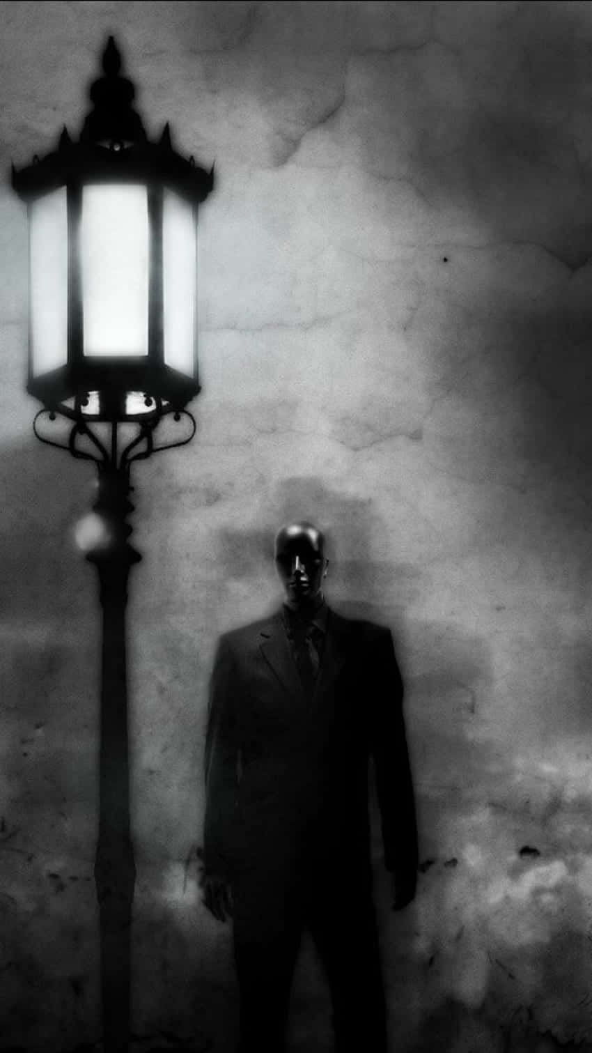 A man in suit standing by the street lamp - Horror, creepy