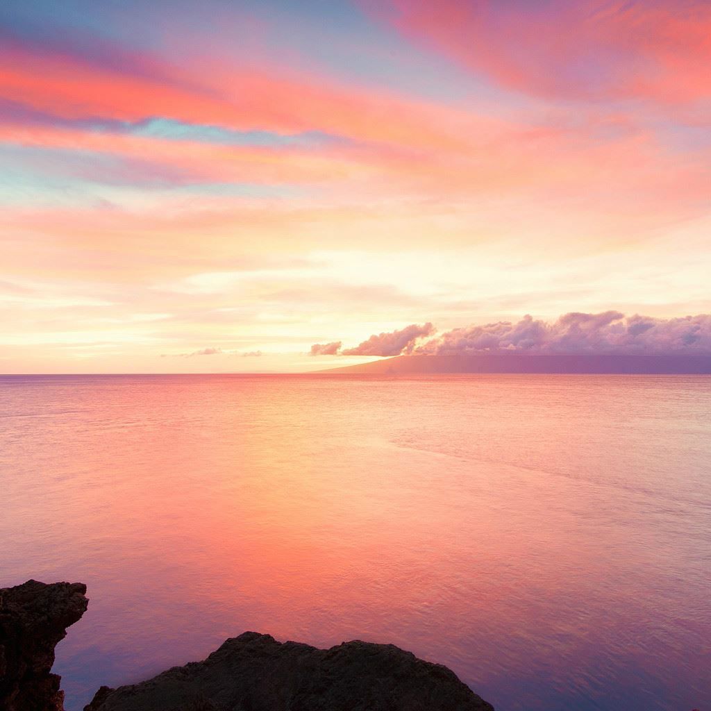 A stunning pink and purple sunset over the ocean - Calming