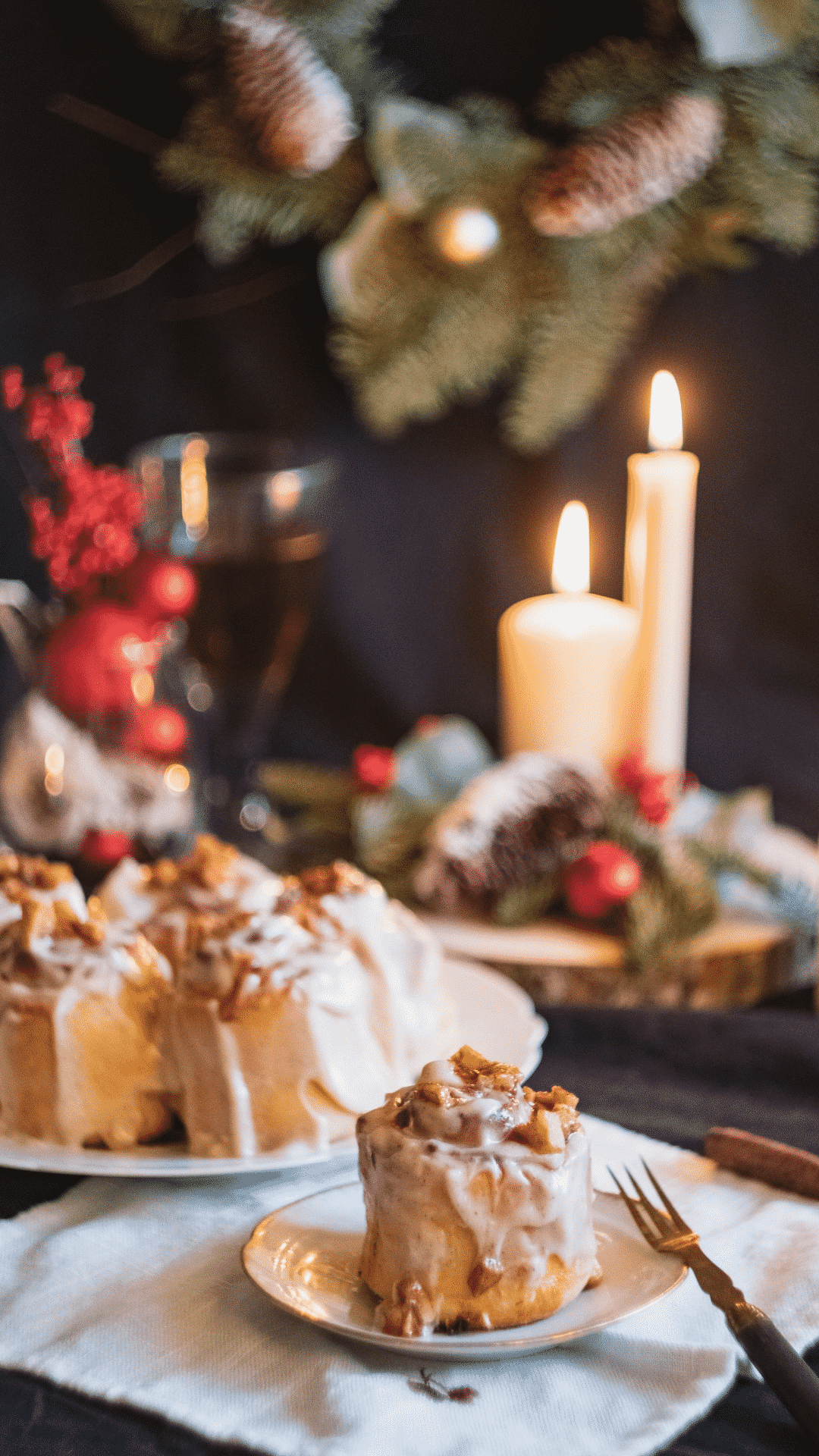 A table with plates of food and candles - Bakery