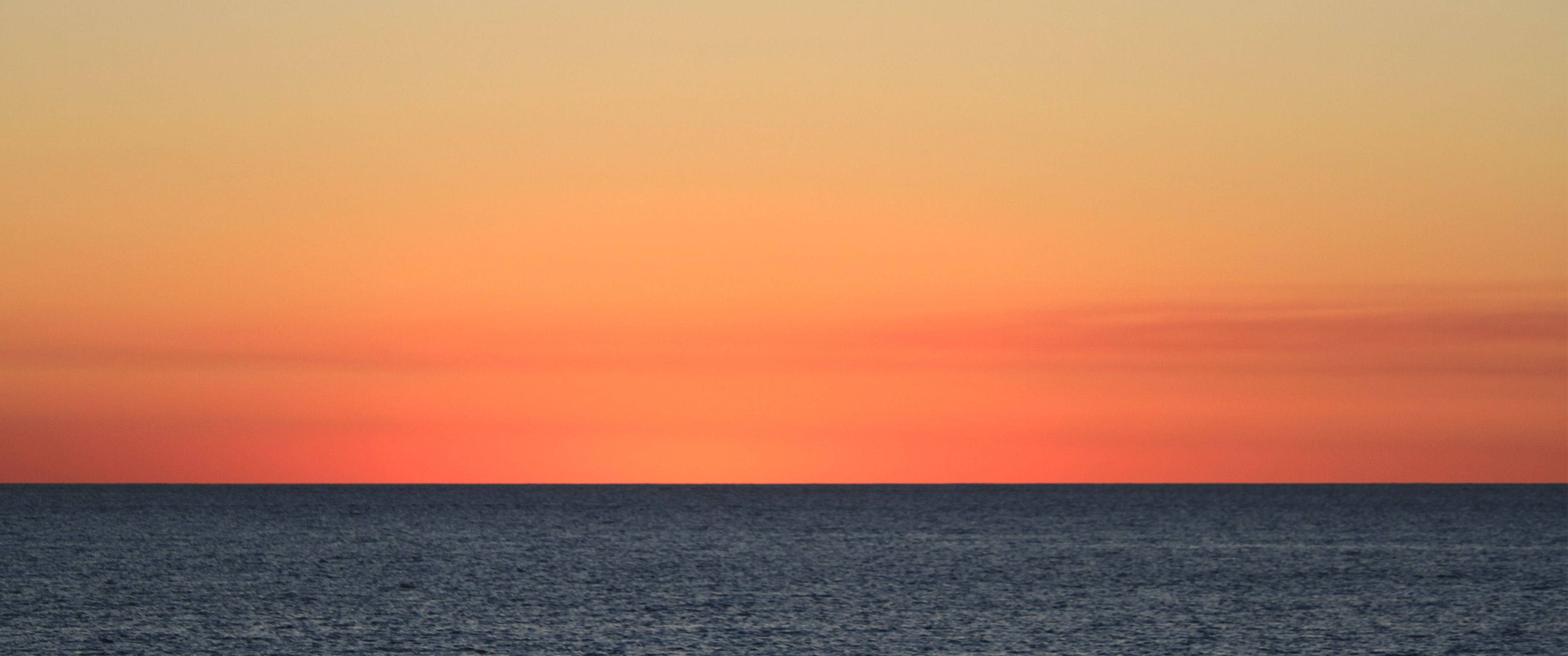 Download 3440x1440 Minimalist Orange Sea Skies Wallpaper