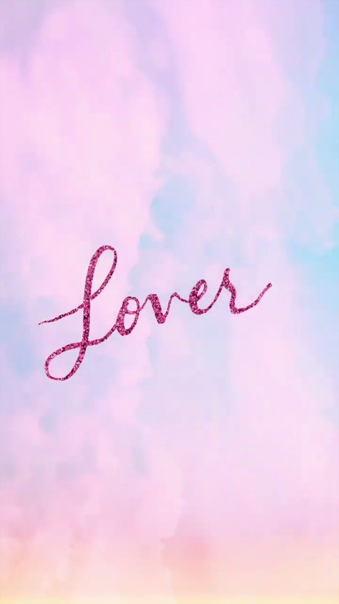 The word lover is written in pink letters against a blue sky - Taylor Swift