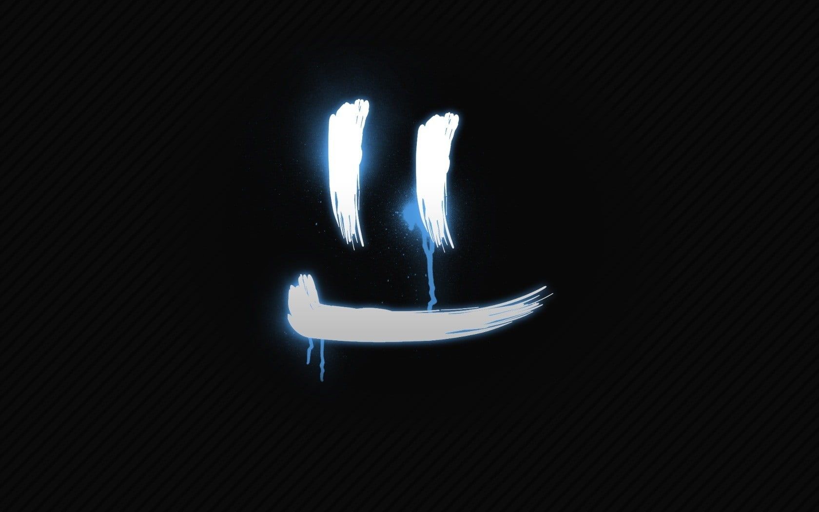 A smiley face made out of light on a black background - Emoji