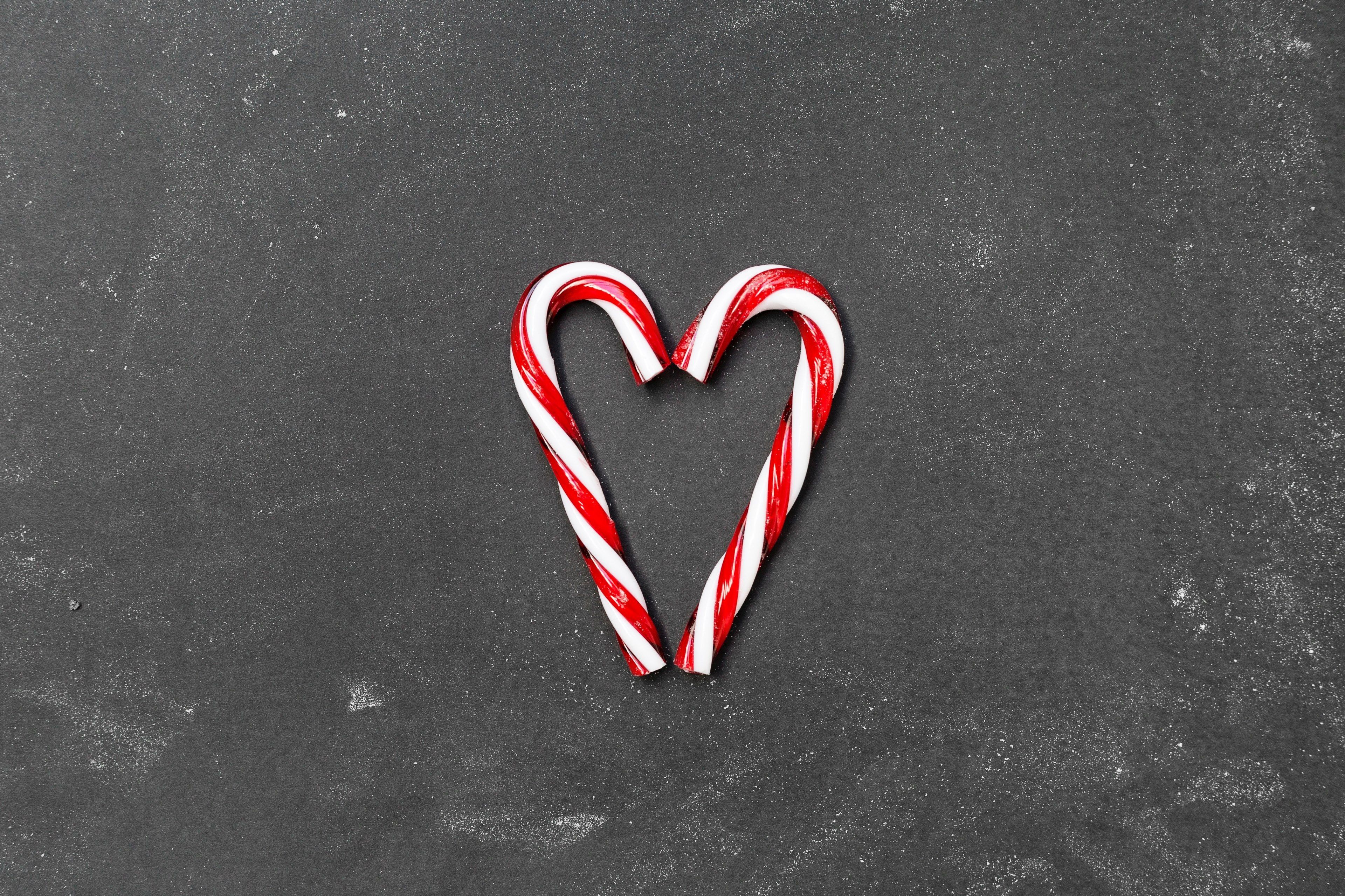 A candy cane in the shape of heart - Candy cane