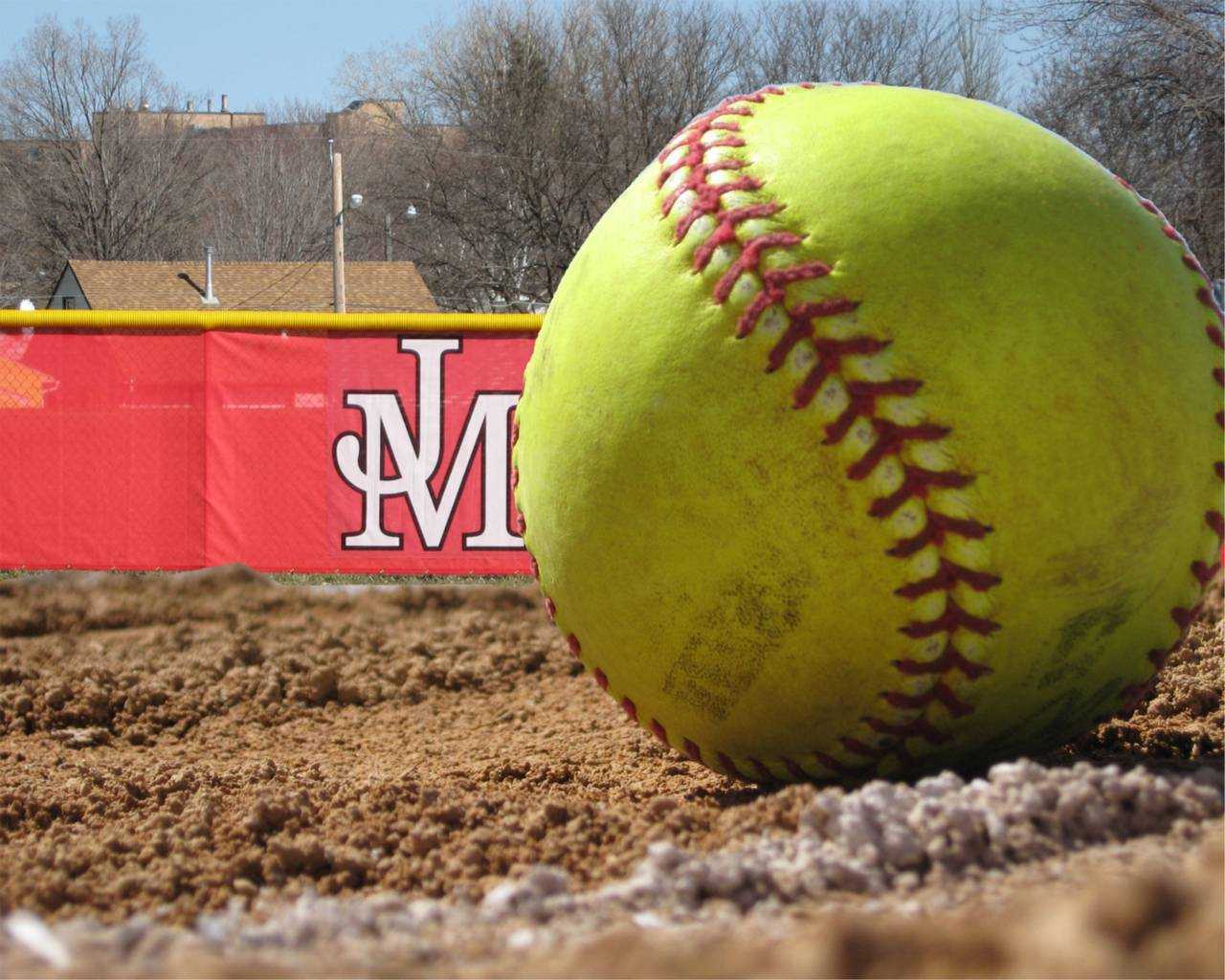 A softball sits on the pitcher's mound at the university - Softball