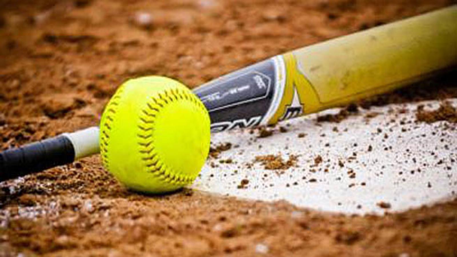 A softball bat and ball on the ground - Softball