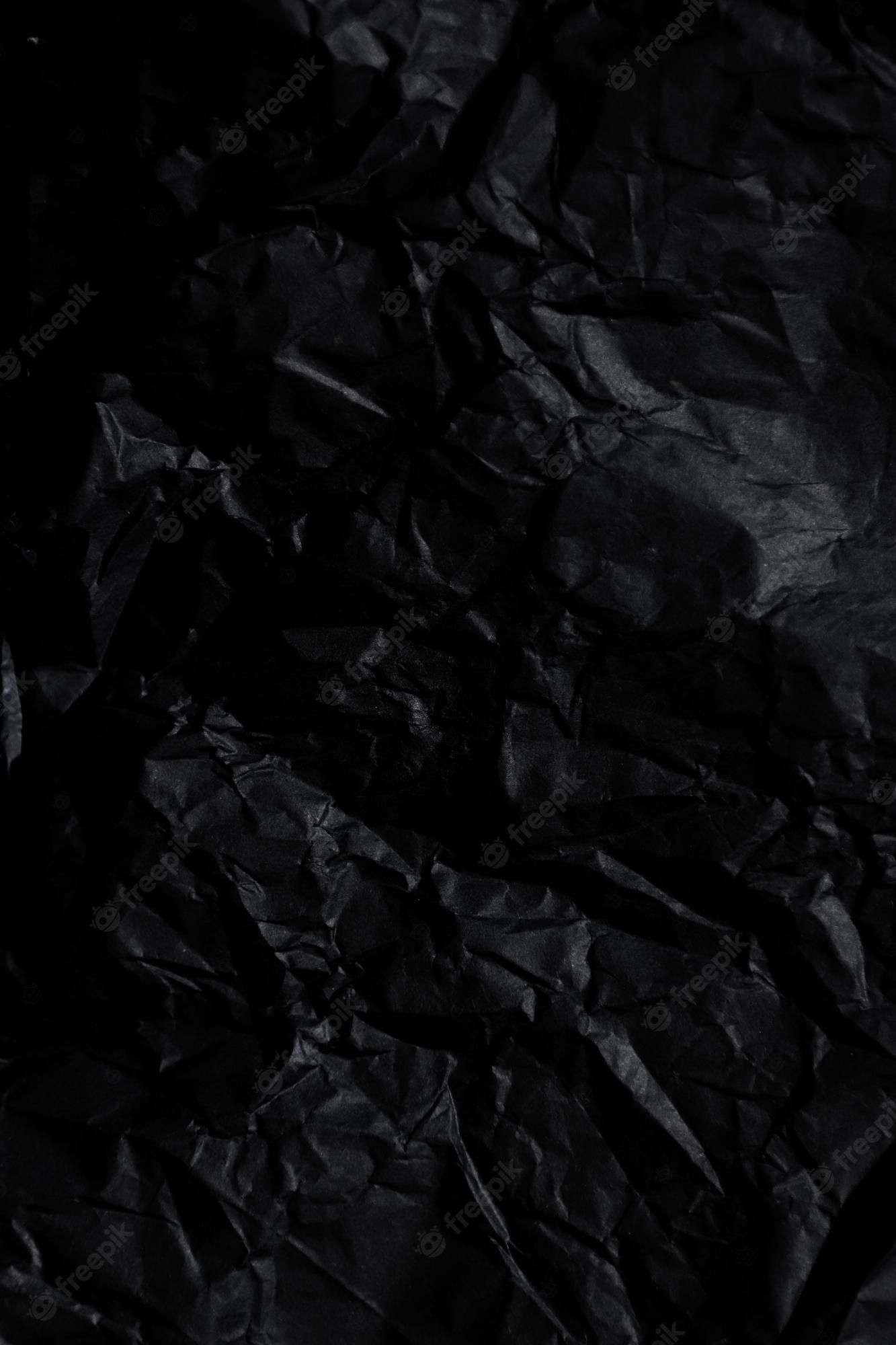 A black crumpled paper background - Grunge