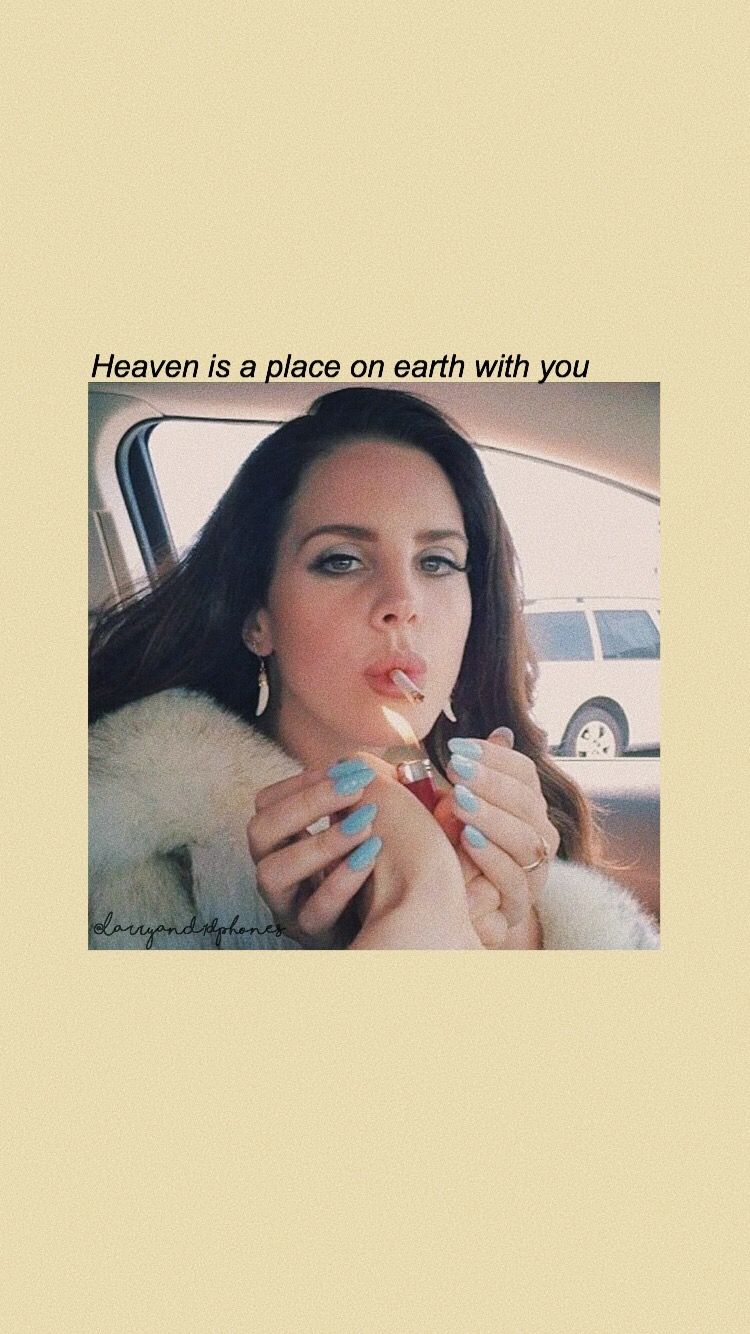 A woman in the car with her hand on something - Lana Del Rey