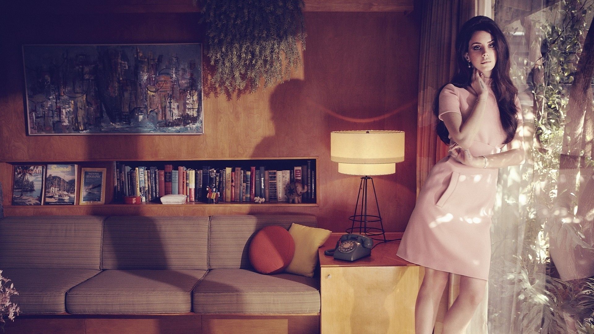 A woman standing in front of an open window - Lana Del Rey