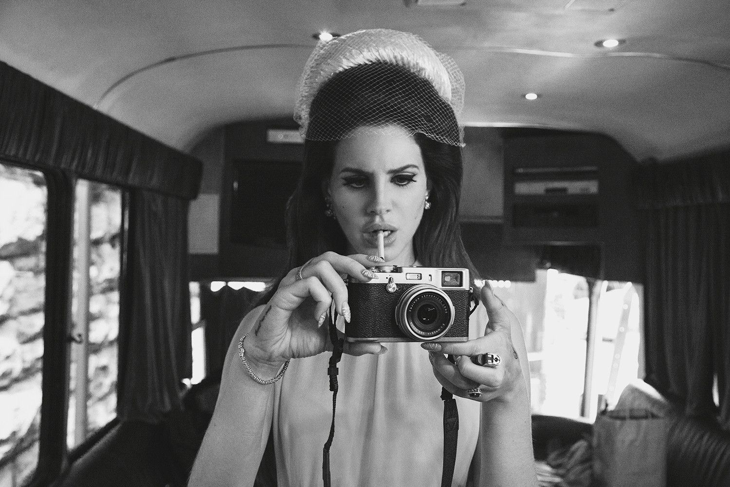 A bride takes a picture of the camera with her vintage camera - Lana Del Rey
