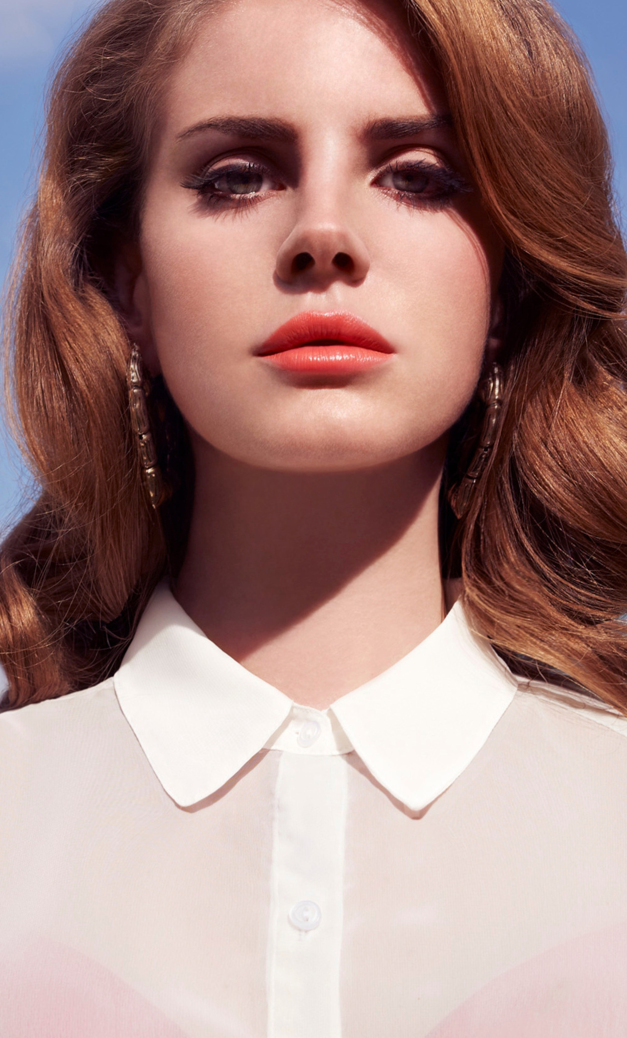 A woman with long hair and red lipstick - Lana Del Rey