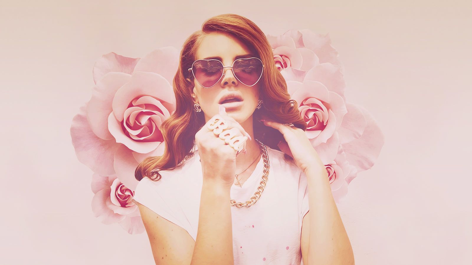 A woman with sunglasses and flowers around her - Lana Del Rey