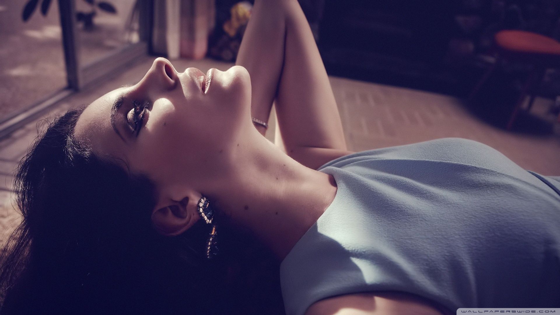A woman lying on the floor - Lana Del Rey
