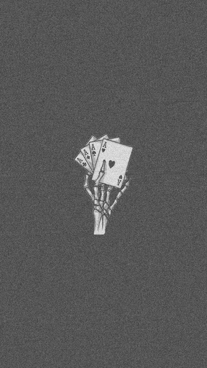A skeleton hand holding a royal flush of playing cards - Grunge