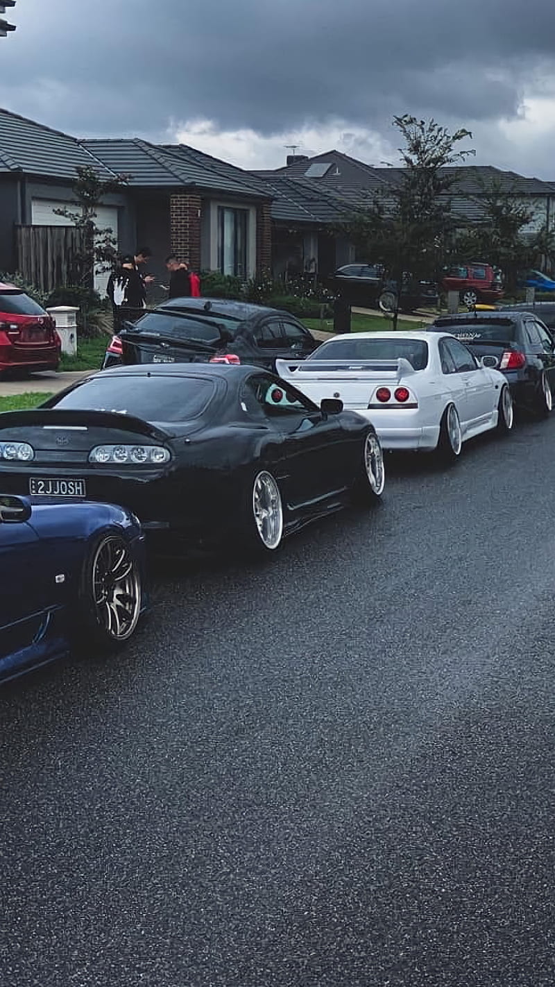 A group of cars parked on the sidewalk - JDM