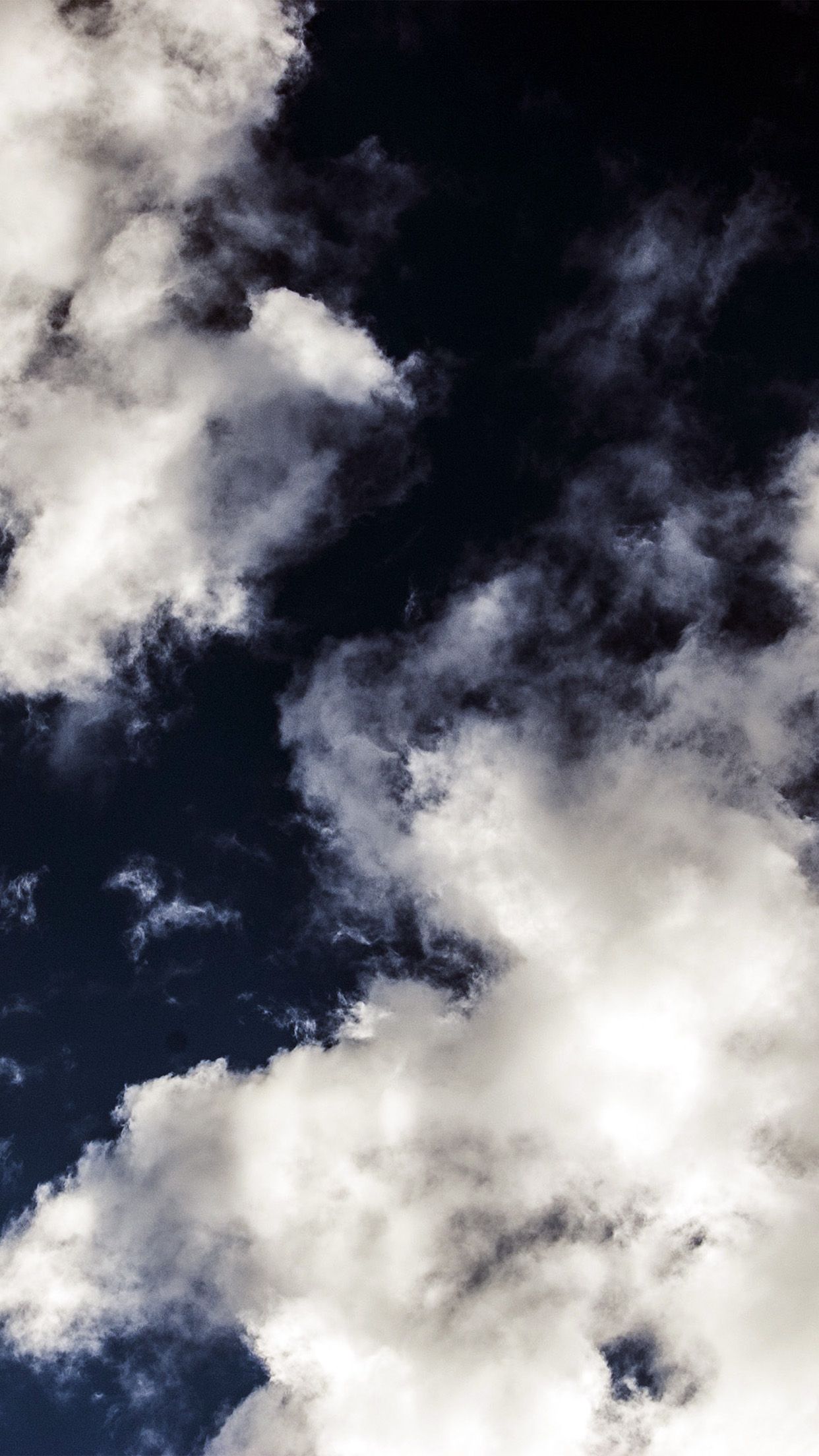 A man is flying his kite in the sky - Light blue, dark blue, navy blue, cloud, sky